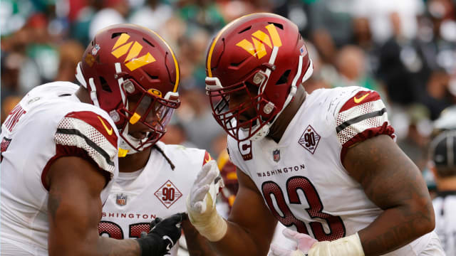 Washington Commanders defensive tackle Daron Payne (94) celebrates with Commanders defensive tackle Jonathan Allen (93) after a safety against the Philadelphia Eagles at FedExField.